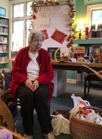 Surrounded by yarn, wool and books, Irma Schilling looks right at home.